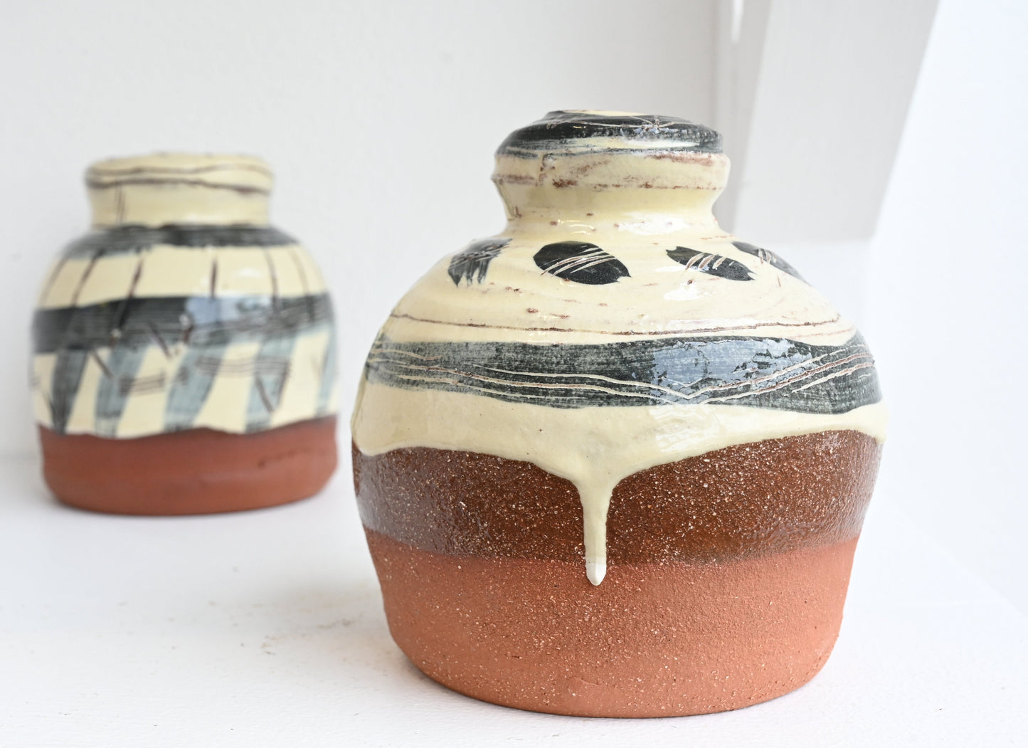 Terracotta watering roses by Camille Biddell